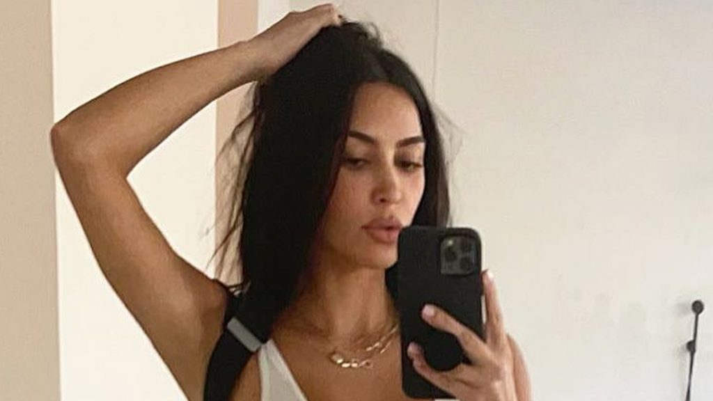 Kim Kardashian goes braless and practically busts out of bodysuit in new image taken within huge lavatory of M mansion